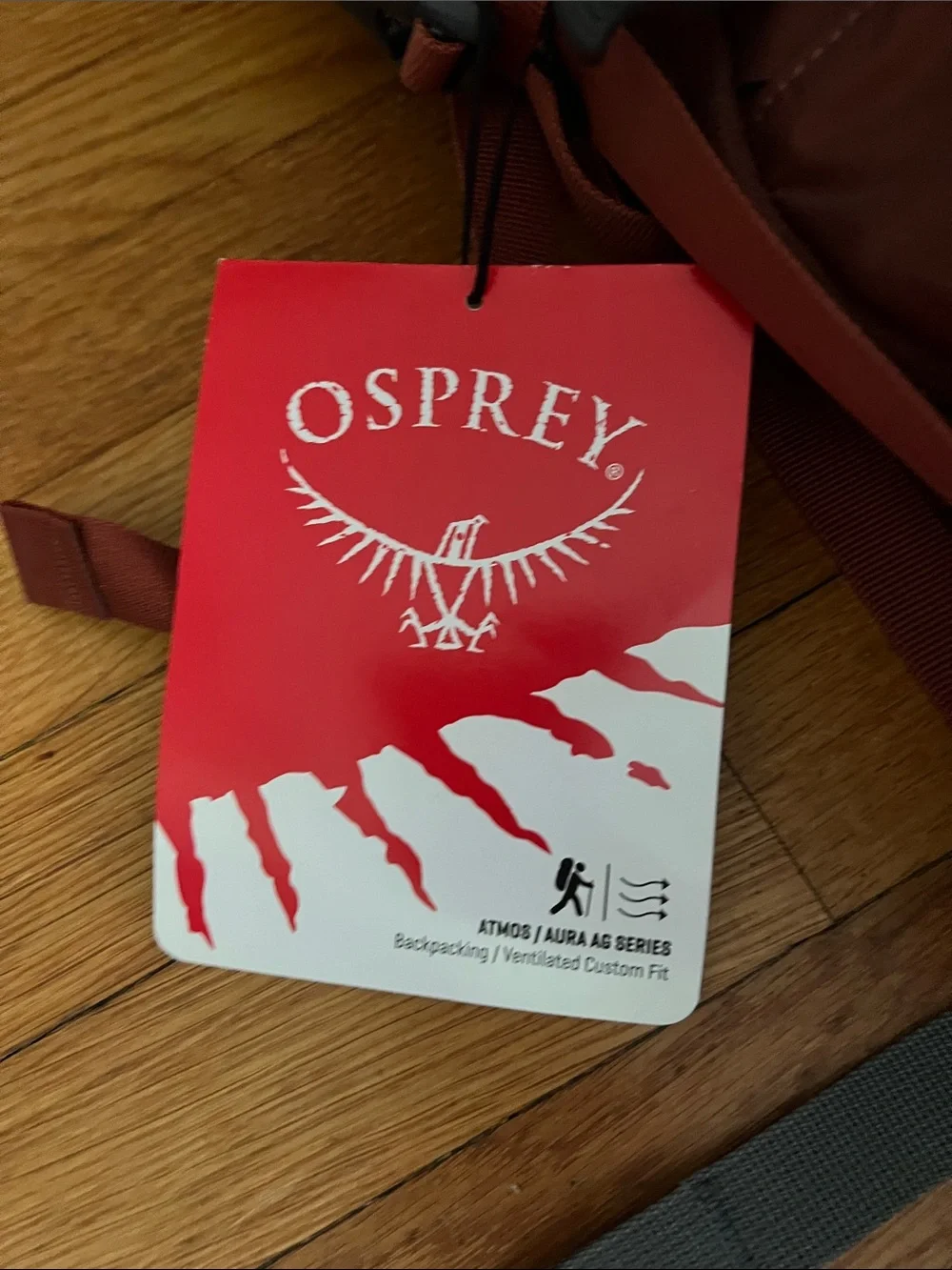 OSPREY Atmos 65 AG Backpack in rust and burgundy